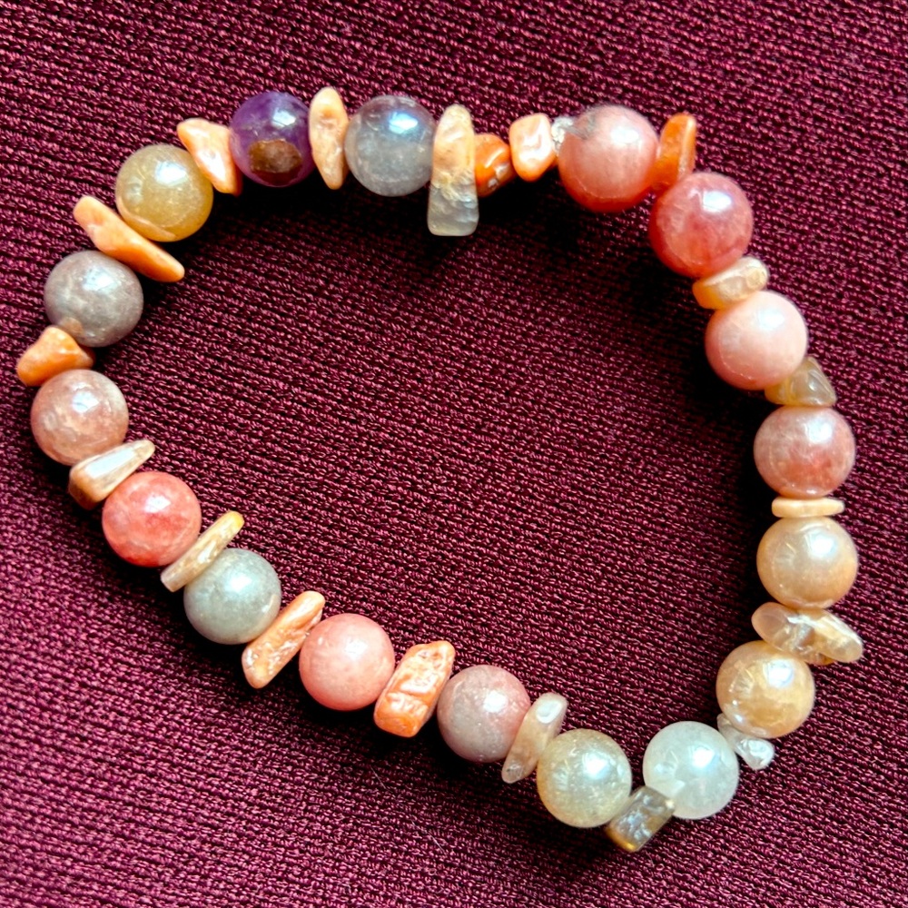 handmade Sunstone bracelet with Amethyst accent bead for uplifting mood.